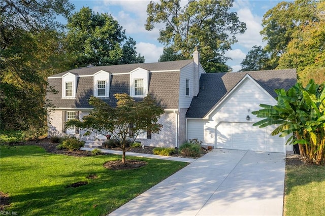 view of front of house with a front yard and a garage