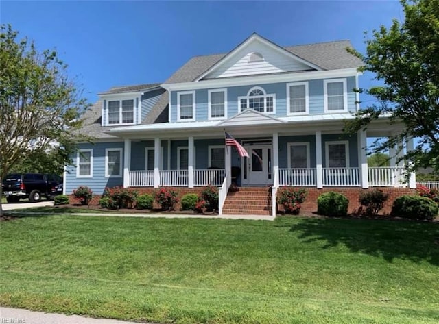 view of front of house featuring a front yard and a porch