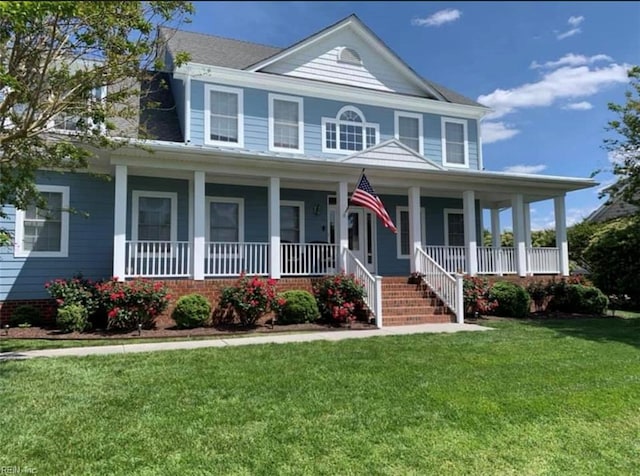 view of front of property with a front yard and covered porch