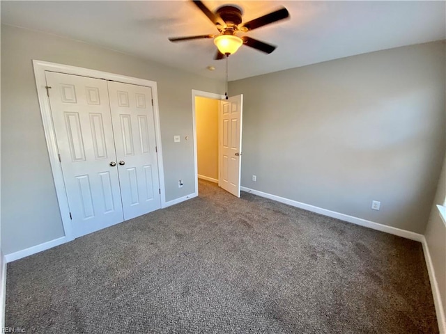 unfurnished bedroom featuring a closet, ceiling fan, and dark colored carpet