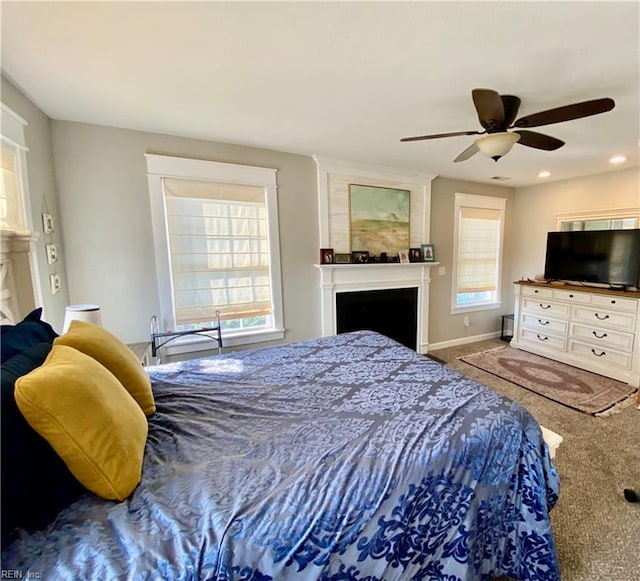 carpeted bedroom featuring ceiling fan