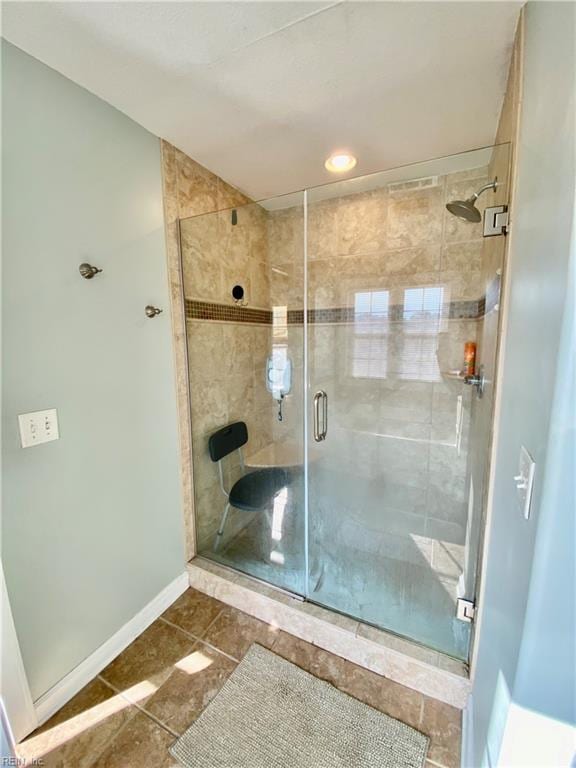 bathroom featuring tile patterned floors and walk in shower