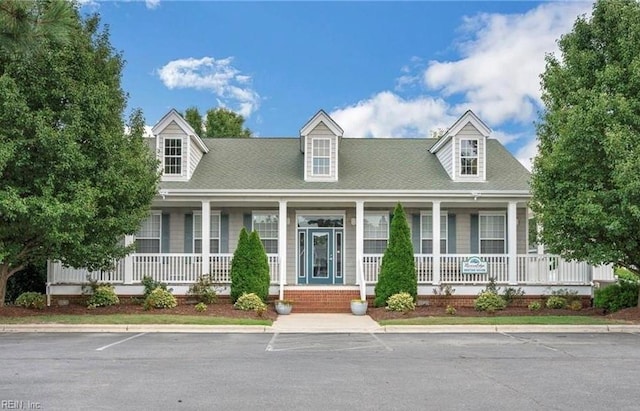 cape cod home with covered porch