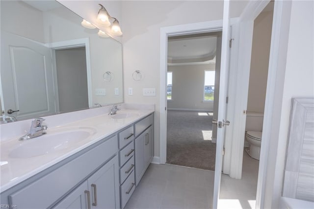 bathroom with vanity and toilet