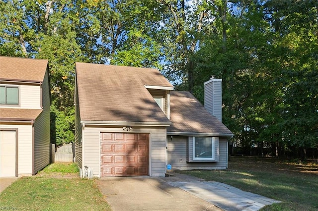 view of front of house with a front lawn and a garage