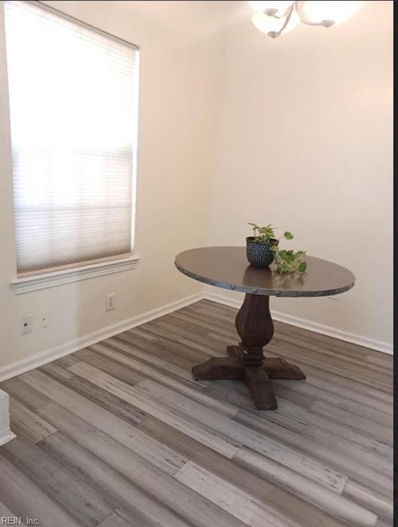 unfurnished dining area featuring hardwood / wood-style flooring and breakfast area