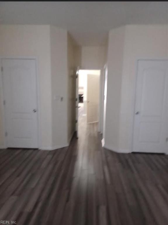 hall with dark hardwood / wood-style flooring