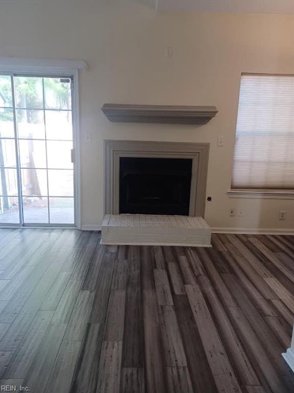 details featuring a brick fireplace and hardwood / wood-style flooring