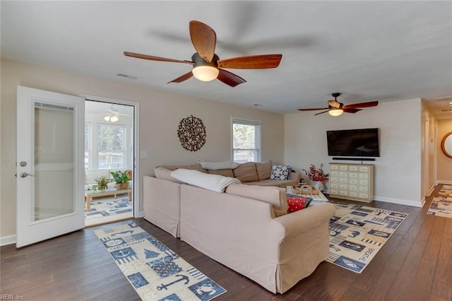 living room featuring french doors, ceiling fan, and dark hardwood / wood-style flooring