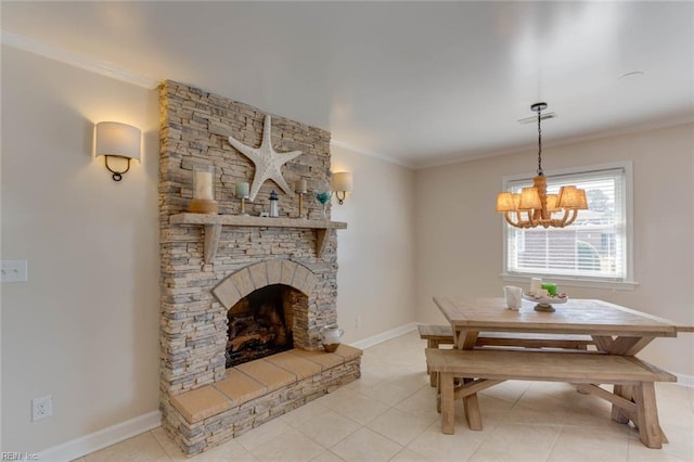 tiled dining room featuring an inviting chandelier, ornamental molding, and a fireplace