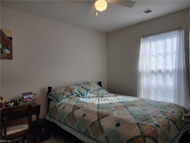 bedroom featuring ceiling fan and carpet