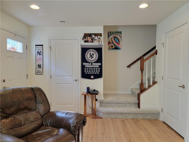 foyer entrance with light hardwood / wood-style flooring