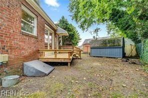 view of yard with a wooden deck