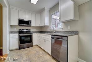 kitchen featuring appliances with stainless steel finishes and white cabinetry