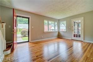 unfurnished living room featuring light hardwood / wood-style flooring