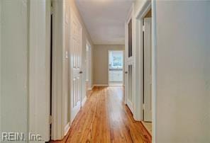 hall with light hardwood / wood-style flooring