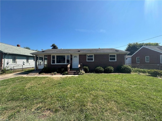 single story home featuring a front lawn