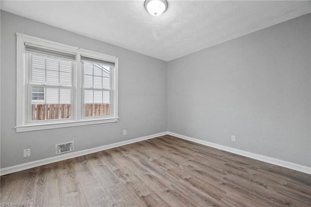 empty room featuring wood-type flooring