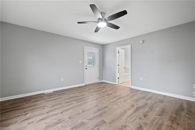 spare room with ceiling fan and light hardwood / wood-style floors