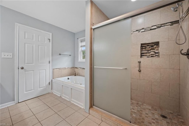 bathroom with separate shower and tub and tile patterned flooring