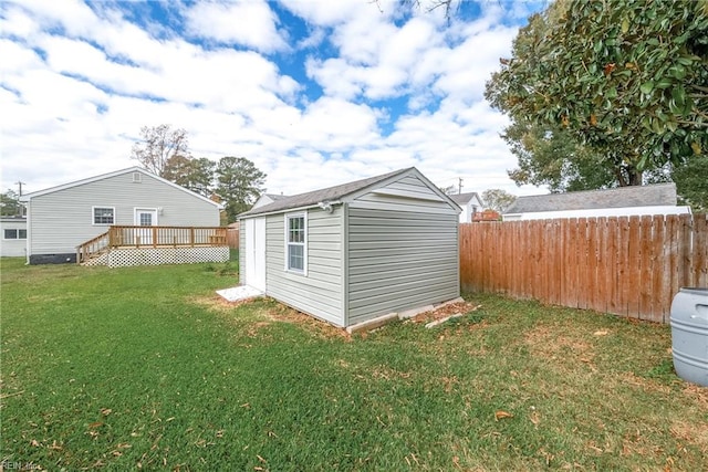 exterior space with a wooden deck and a shed