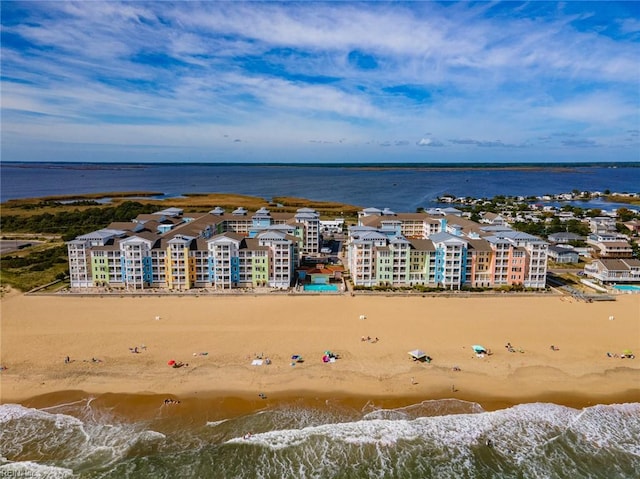 bird's eye view with a water view and a view of the beach