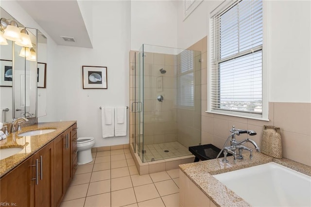 full bathroom with vanity, toilet, independent shower and bath, and tile patterned flooring