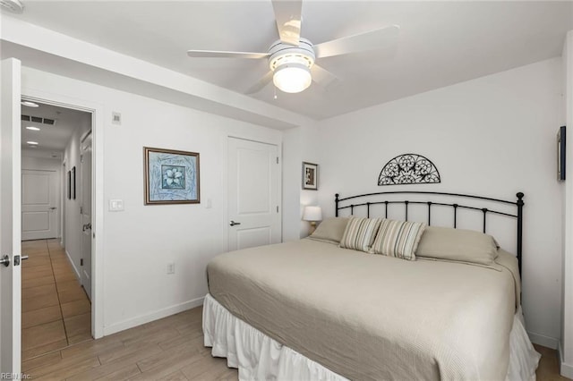 bedroom featuring light wood-type flooring and ceiling fan