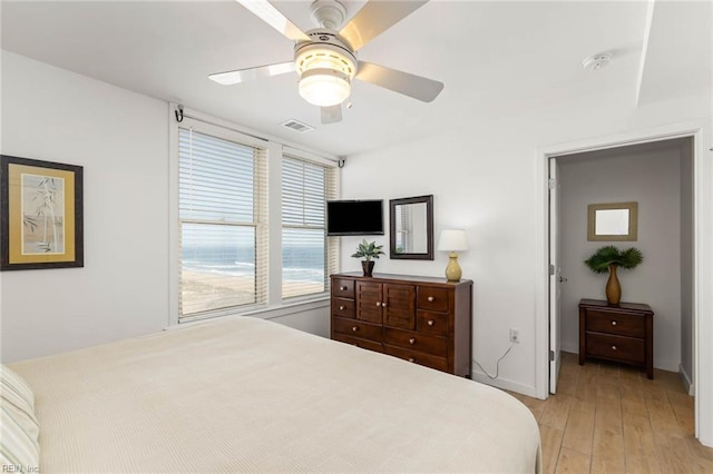 bedroom featuring light hardwood / wood-style flooring and ceiling fan