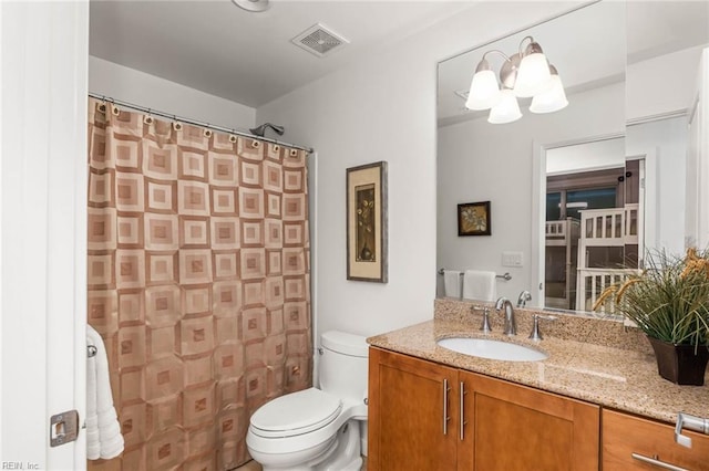 bathroom with vanity, toilet, and a shower with curtain