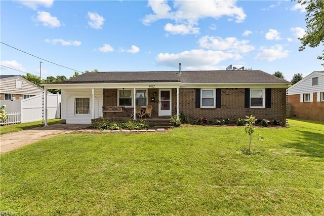 single story home with covered porch and a front yard