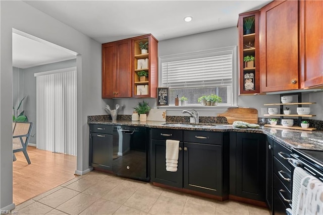 kitchen featuring electric range oven, sink, dark stone countertops, black dishwasher, and light hardwood / wood-style floors