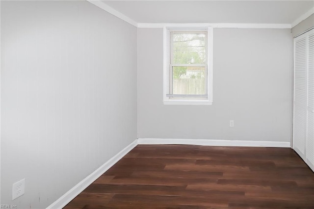 unfurnished bedroom featuring dark hardwood / wood-style floors