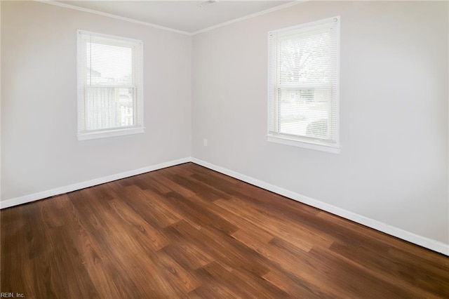 unfurnished room featuring ornamental molding and hardwood / wood-style floors