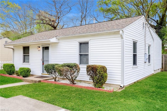 ranch-style home with a front yard