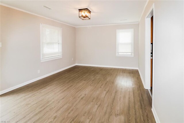 5111 81st St, Hampton, VA 23605 - empty room with ornamental molding, wood finished floors, and baseboards