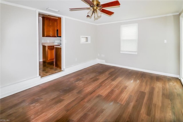 5111 81st St, Hampton, VA 23605 - spare room with dark wood-type flooring, ceiling fan, baseboards, crown molding, and plenty of natural light