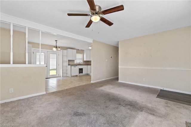 unfurnished living room with light carpet and ceiling fan