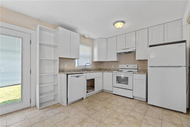 kitchen featuring white cabinets, sink, and white appliances