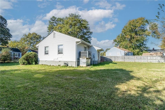 view of property exterior with a lawn