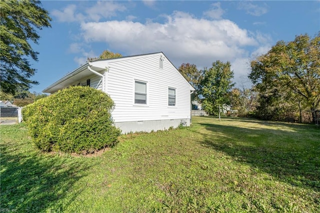 view of property exterior with a lawn