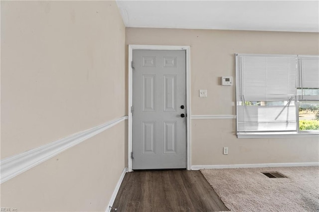 foyer with dark hardwood / wood-style flooring