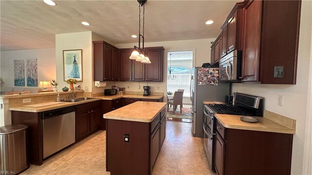 kitchen with a kitchen island, dark brown cabinets, stainless steel appliances, sink, and pendant lighting