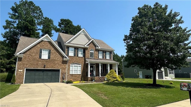 view of front of house with a front lawn and a garage