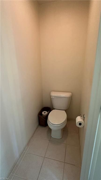 bathroom featuring toilet and tile patterned flooring