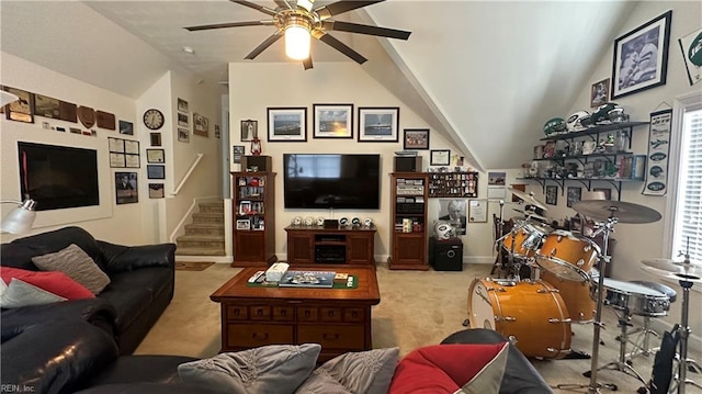 carpeted living room featuring ceiling fan, vaulted ceiling, and a wealth of natural light