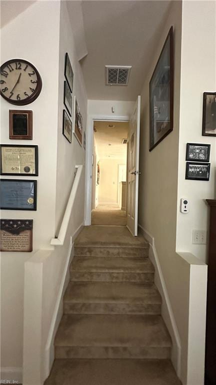 staircase featuring hardwood / wood-style flooring