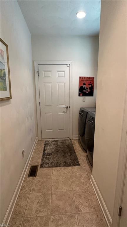 clothes washing area featuring washing machine and dryer