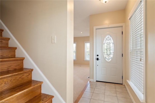 foyer entrance featuring light tile patterned floors