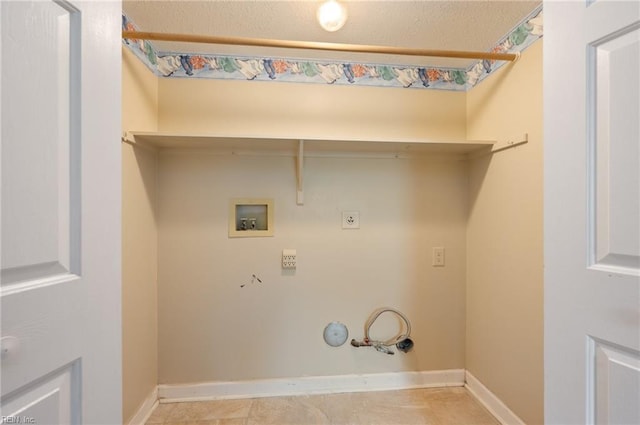 clothes washing area featuring washer hookup, electric dryer hookup, hookup for a gas dryer, and light tile patterned floors